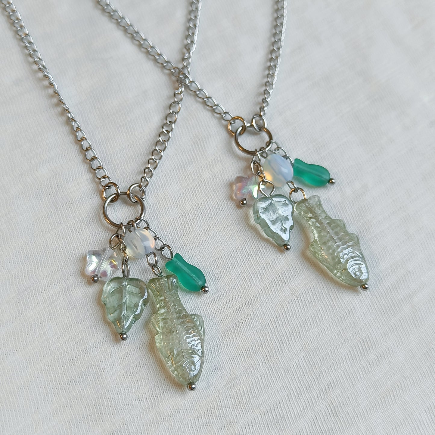 GREEN FISH CHARM NECKLACE